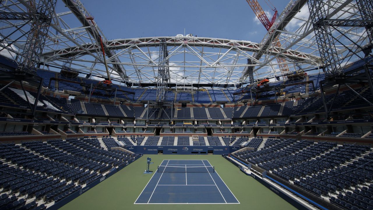 General view of Arthur Ashe Stadium while the final piece of steel for the roof structure it's installed at the USTA Billie Jean King National Tennis Center in New York City on June 10, 2015. AFP PHOTO/ Kena Betancur (Photo credit should read KENA BETANCUR/AFP/Getty Images)