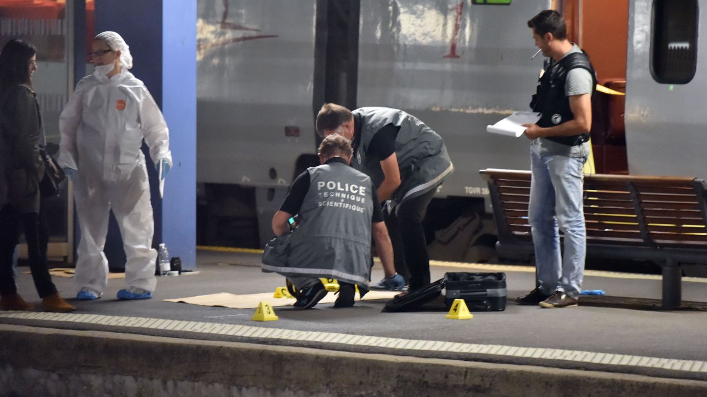 Police work on a platform next to a high-speed train in Arras, France, on Friday, August 21.