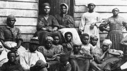 Portrait of Civil War 'contrabands,' fugitive slaves who were emancipated upon reaching the North, sitting outside a house, possible in Freedman's Village in Arlington, Virginia, mid 1860s. Up to 1100 former slaves at a time were housed in the government established Freedman's Village in the thirty years in which it served as a temporary shelter for runaway and liberated slaves. (Photo by Hulton Archive/Getty Images)