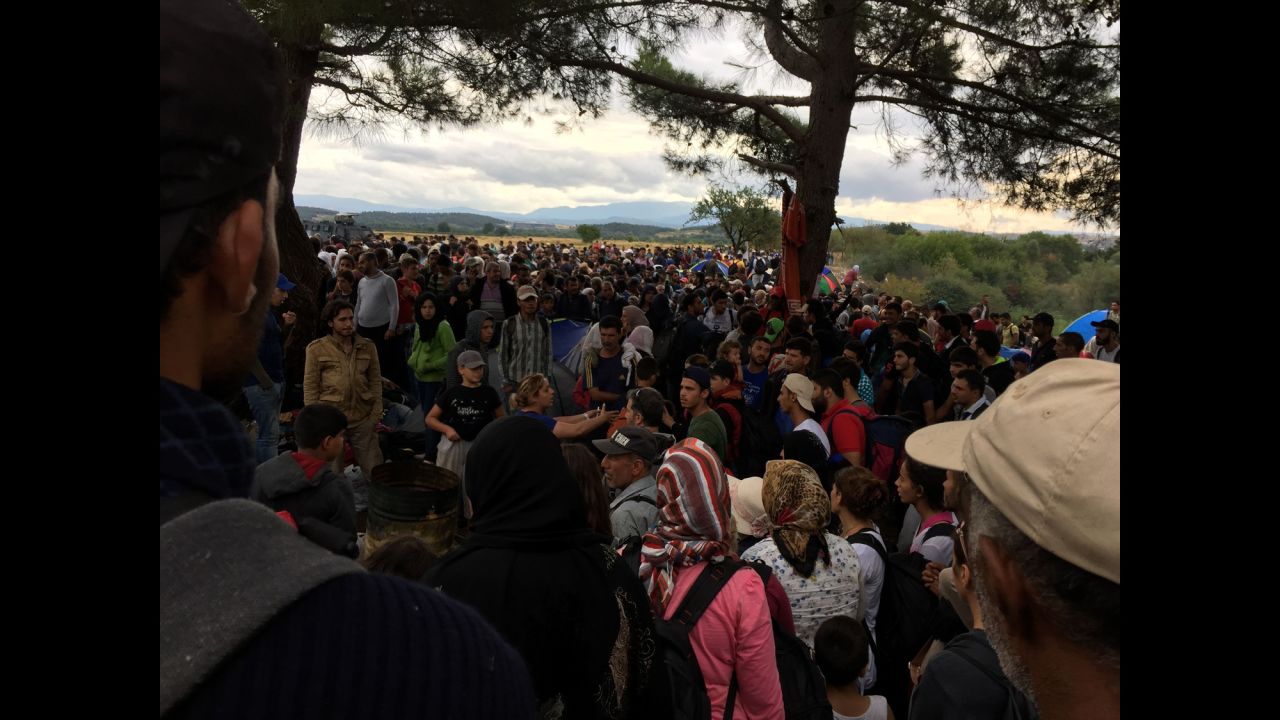 Migrants wait anxiously at the border. Macedonia has been allowing a trickle of migrants to enter into the country. 