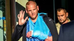 Off-duty US Air Force Spencer Stone (L), one of the men to overpower the gunman who opened fire with an assault rifle on a high-speed train, gestures as he leaves the hospital of Lesquin, northern France on August 22. On August 21, a gunman opened fire on the train traveling from Amsterdam to Paris, injuring two people before being tackled by several passengers including off-duty American servicemen. Spencer Stone was first to the gunman who slashed him in the neck and almost sliced off his thumb with a box-cutter.
