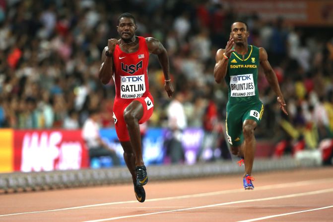 Justin Gatlin also won his heat to qualify for Sunday's semifinals, but the American's time of 9.83s was wind-assisted.