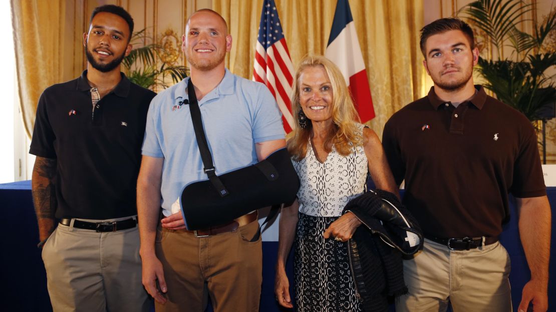  From left: Anthony Sadler, Spencer Stone, Alek Skarlatos and U.S. ambassador to France Jane Hartley pose after a press conference at the U.S. Embassy in Paris on August 23, 2015. 
