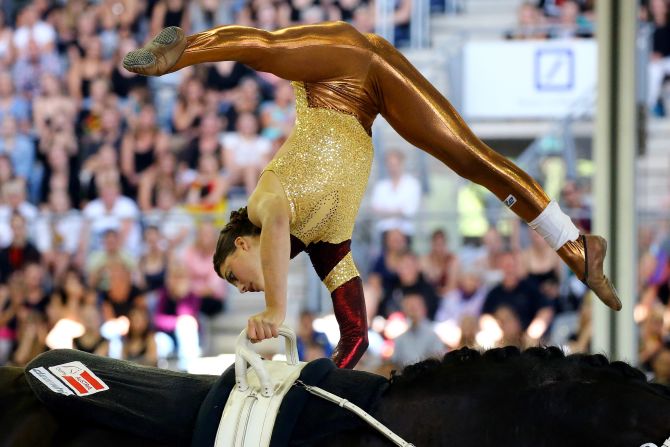 Austria's Lisa Wild performs on Robin during the women's Vaulting freestyle final. The European Championships, which ran from August 11-23, attracted the best riders from all over the continent. Wild's acrobatics earned her third place behind Germany's Corinna Knauf and Swiss winner Simone Jaiser. 