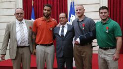 From the left, British businessman Chris Norman, Anthony Sadler, a senior at Sacramento University in California, French President Francois Hollande, U.S. Airman Spencer Stone, and Alek Skarlatos a U.S. National Guardsman from Roseburg, Oregon pose at the Elysee Palace, Monday Aug.24, 2015 in Paris, France. Hollande pinned the Legion of Honor medal on U.S. Airman Spencer Stone, National Guardsman Alek Skarlatos, and their years-long friend Anthony Sadler, who subdued the gunman as he moved through the train with an assault rifle strapped to his bare chest. The British businessman, Chris Norman, also jumped into the fray. (AP Photo/Michel Euler, Pool)