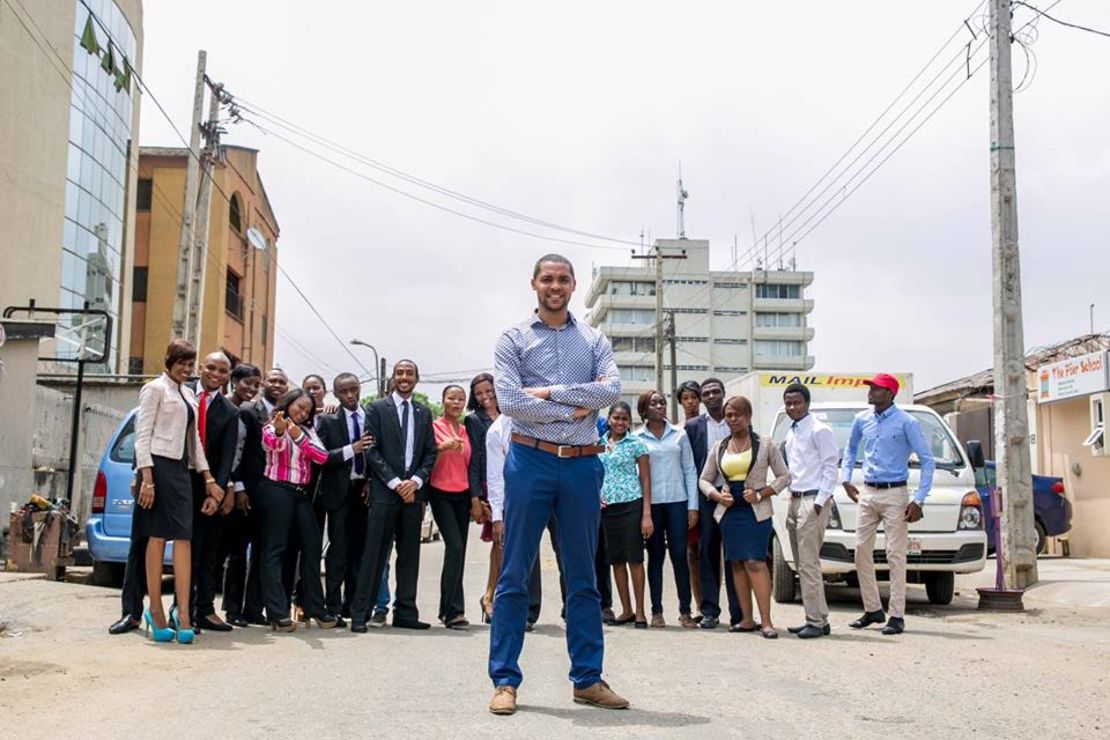 Mark Essien with his growing Hotels.ng team on Olonade street in Sabo, Yaba, Lagos.