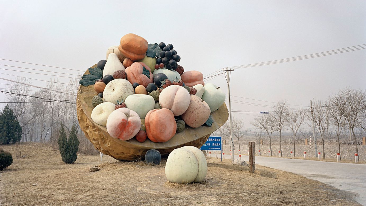 Stefano Cerio's images for "Chinese Fun", shot using an old plate camera, explore the grim realities of off-season and abandoned theme parks and the props that get left behind.<br /><br />This gigantic bowl of concrete fruit was found by the roadside on the outskirts of Beijing, where many orchards are located. 