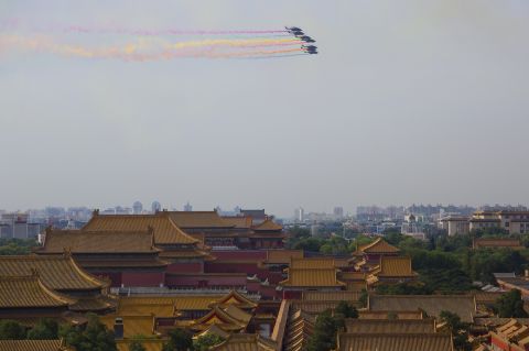 Chinese military helicopters fly over the Forbidden City in Beijing on August 23. Most of the armaments that will go on display during the parade won't have been seen by the public before, Xinhua reported. 