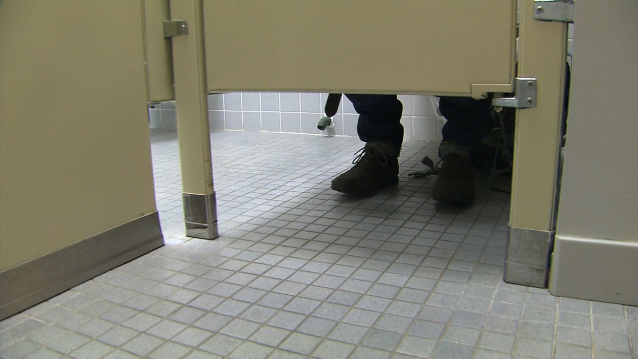 Eric, a poop donor for OpenBiome, in the men's room.