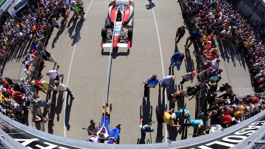 Crew members pull Wilson's car onto the grid before the Indianapolis 500 in May.