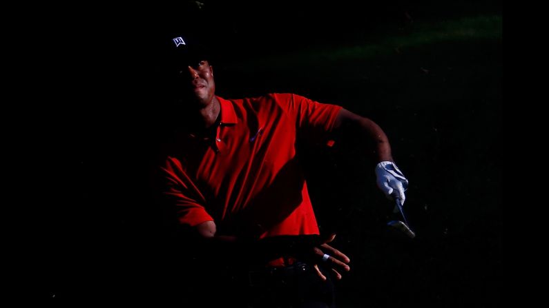 Tiger Woods plays a shot Sunday, August 23, during the final round of the Wyndham Championship in Greensboro, North Carolina. Woods finished the tournament tied for 10th, <a href="index.php?page=&url=http%3A%2F%2Fwww.cnn.com%2F2015%2F08%2F24%2Fgolf%2Ftiger-woods-wyndham-final-round%2Findex.html" target="_blank">ending his season on the PGA Tour.</a> Woods needed to win the event to qualify for the FedEx Cup playoffs.