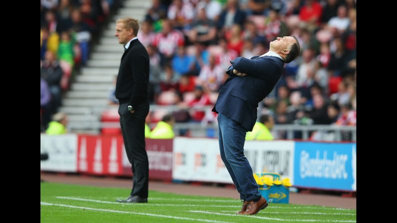 Sunderland manager Dick Advocaat, right, reacts during a Premier League match against Garry Monk's Swansea City on Saturday, August 22. The match in Sunderland, England, ended in a 1-1 draw.