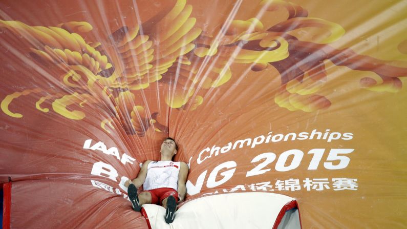 Poland's Pawel Wojciechowski lies on the mat after crashing out in the World Championships' pole-vault final on Monday, August 24. He finished in third place.