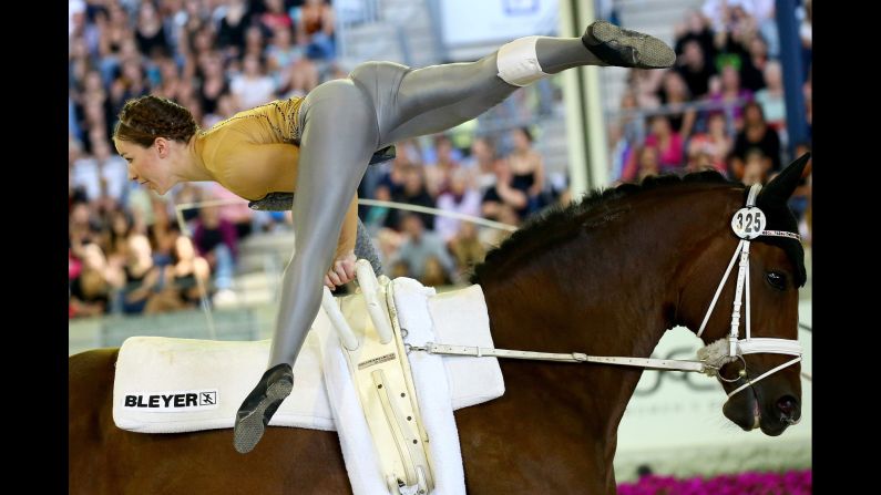 Germany's Corinna Knauf performs on Fabiola during the vaulting final of the European Equestrian Championships. She won silver in the event, which finished Sunday, August 23, in Aachen, Germany.