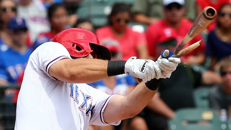 Mitch Moreland of the Texas Rangers breaks his bat as he hits an RBI single against Seattle on Wednesday, August 19.