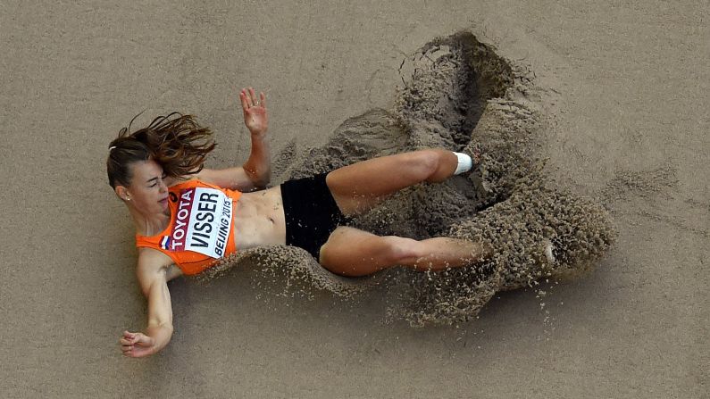 Dutch heptathlete Nadine Visser lands in the sand pit after a long-jump attempt Sunday, August 23, at the World Championships.