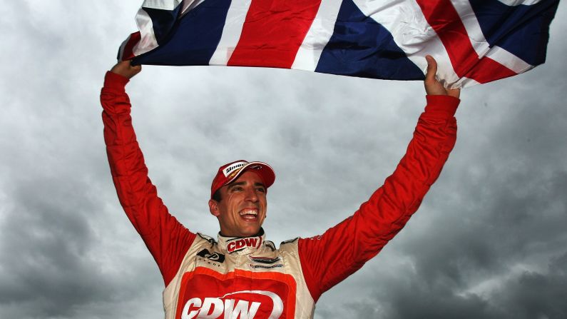 Wilson waves his flag after the race in Assen in September 2007.