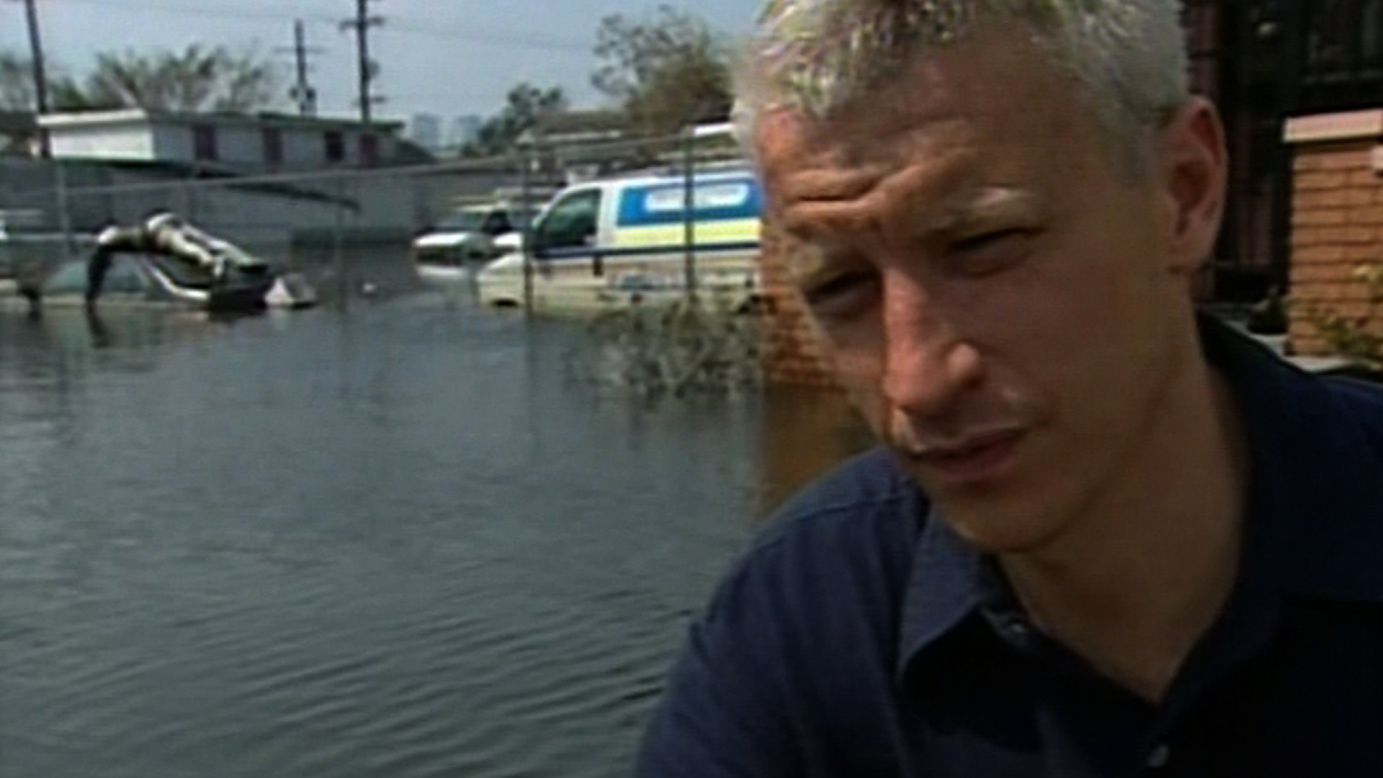 CNN's Anderson Cooper, covering Hurricane Katrina in New Orleans in 2005, reports on seeing a body on top of a car a week after the storm.