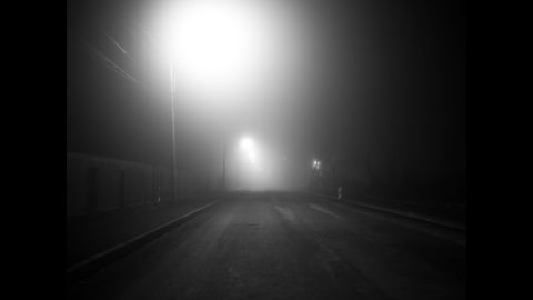 An empty street at night in Bucharest.
