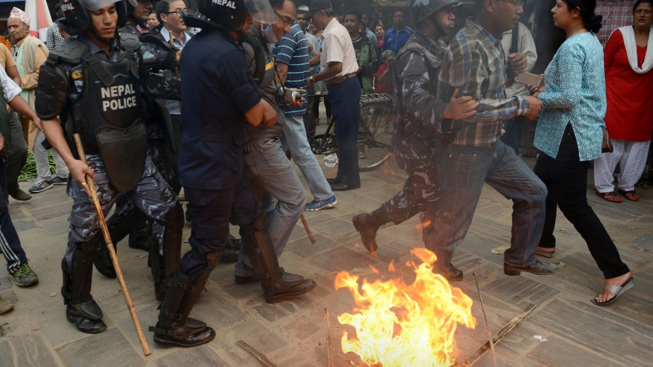 Nepalese police arrest supporters of opposition political parties during a protest against the draft constitution in Kathmandu on August 15, 2015. 