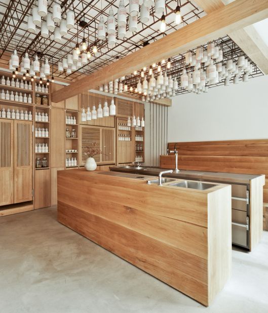 Simple oak woodwork and artisanal ceramics are paired with smooth concrete floors in this gently inviting space in Munich designed by local design practice <a href="http://www.buerowagner.eu/" target="_blank" target="_blank">Buero Wagner</a>. <br /><br />Design by Buero Wagner, Photo by S&S Schels from Let's Go Out Again, Copyright Gestalten 2015