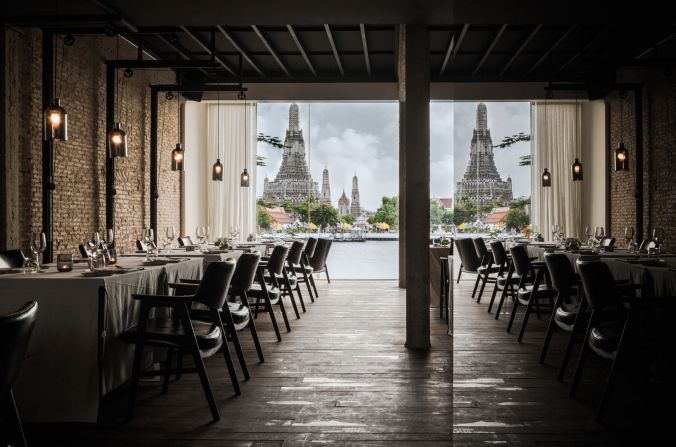 This Bangkok restaurant's design is from local practice <a href="index.php?page=&url=http%3A%2F%2Fwww.onion.co.th%2F" target="_blank" target="_blank">Onion</a>. Located on the banks of the Chao Phraya river, overlooking the legendary temple of the dawn (Wat Arun), modern interior design is folded into spiritual surroundings. <br /><br />Design by Onion, Photo by Wison Tungthunya, W Workspace from Let's Go Out Again, Copyright Gestalten 2015