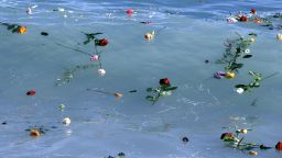 Flowers float in the sea after they were thrown into the Mediterranean in honor of the migrants lost making the perilous journey across the sea, on April 28, 2015 in Nice, southeastern France. Nearly 5,000 migrants have drowned in waters between Libya and Italy since the start of 2014 with the death rate accelerating significantly since a major Italian search-and-rescue operation was suspended late last year because of cost pressures and opposition from other EU states who said it only encouraged migrants to attempt the journey.
