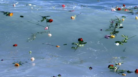 Flowers float in the Mediterranean Sea in honor of migrants lost while making the perilous journey to Europe. 