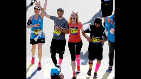 Marathon bombing survivor Adrianne Haslet-Davis crosses the finish line of the 118th Boston Marathon on April 21, 2014 in Boston, Massachusetts.