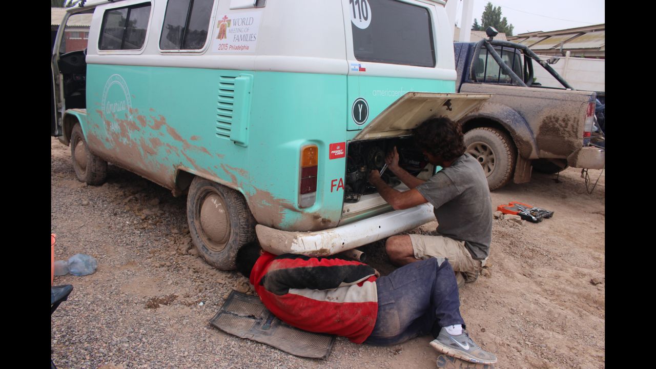 The Volkswagen bus was relatively cheap and certainly endearing, but it has had its problems. Catire has had to fix it several times. Here, Chilean friend Rafa helps with the engine in Copiapo after the devastating floods and mudslides.