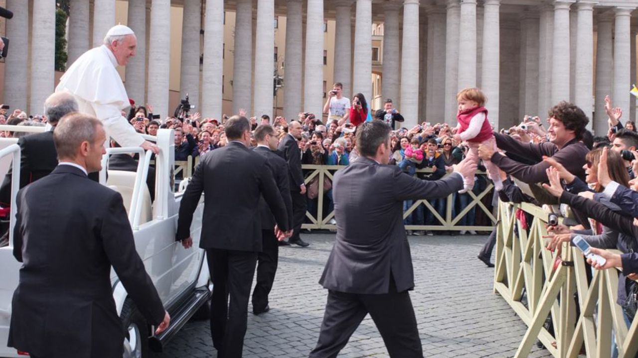 Catire Walker held up his youngest, Carmin, for Pope Francis when the family visited the Vatican in 2013.
