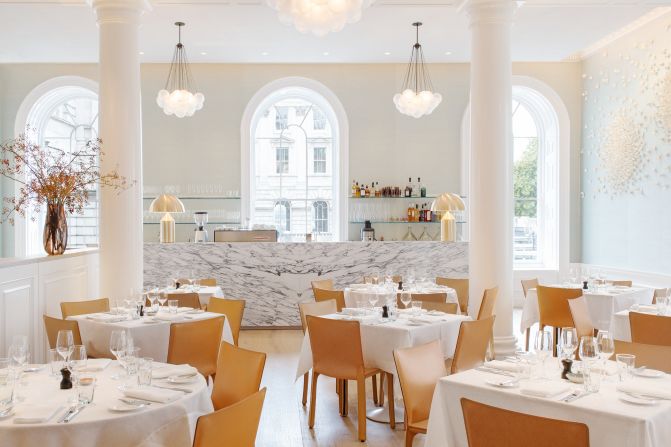 Located in London's Somerset House, <a href="index.php?page=&url=http%3A%2F%2Fspringrestaurant.co.uk%2F" target="_blank" target="_blank">Spring's</a> light-flooded drawing room is thanks to large arched windows, airy high ceilings. Original cornicing frames the space achieved by architect <a href="index.php?page=&url=http%3A%2F%2Fwww.stuartforbes.com%2F" target="_blank" target="_blank">Stuart Forbes</a>. <br /><br />An atrium garden sits enclosed at the room's center with flora and fauna designs by landscape designer Jinny Blom. Other collaborators on the project include artwork by Emma Peascod and Valeria Nascimento and interior design by Australian Briony Fitzgerald.