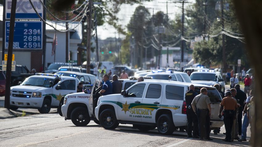 Police gather at the scene of a shooting in Sunset, La., Wednesday, Aug. 26, 2015. (Paul Kieu/The Daily Advertiser via AP) NO SALES; MANDATORY CREDIT