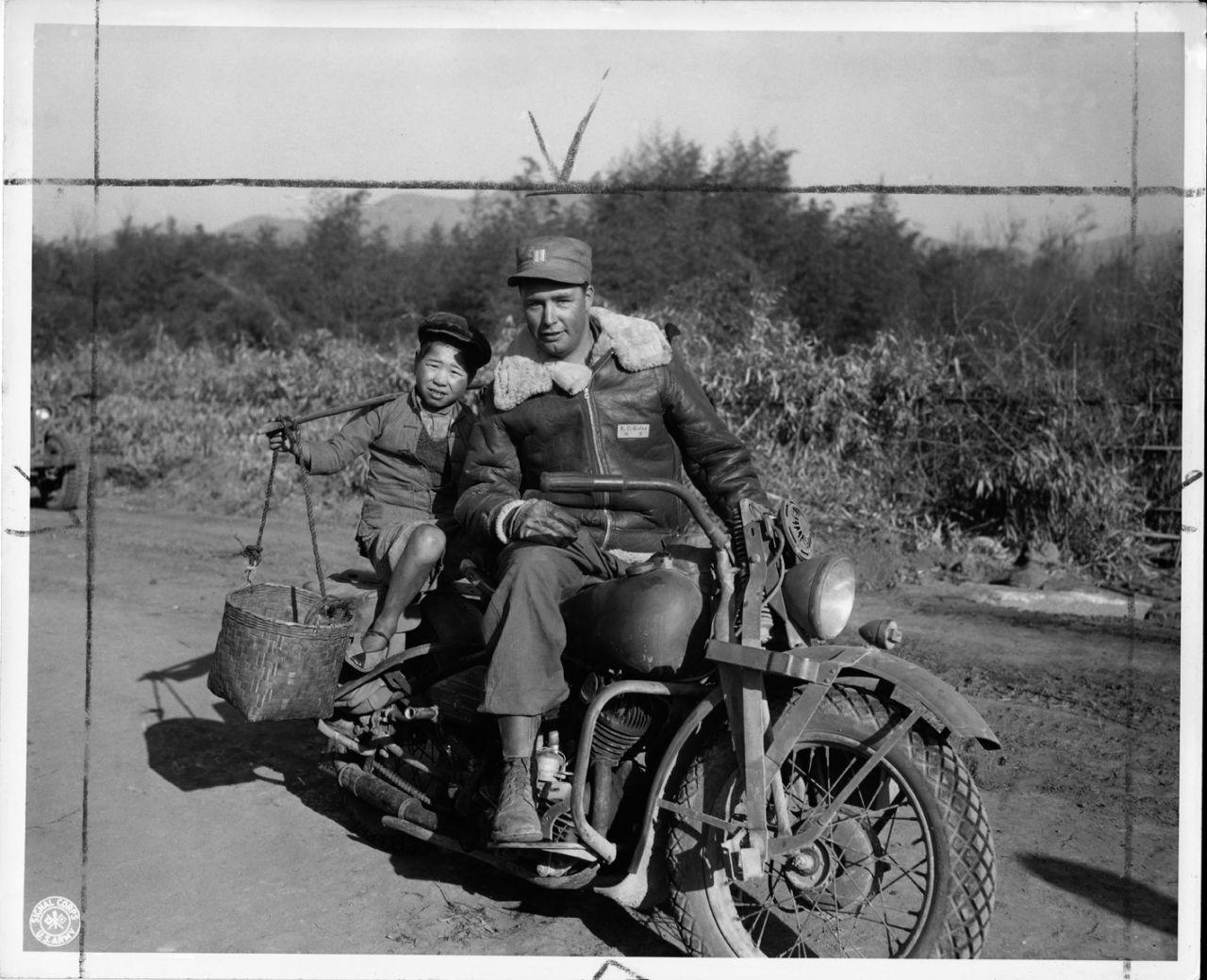 But acknowledging these realities does not mean denying that China's contributions were also very important to the war effort, Mitter adds.  Here, a convoy rider gives a Chinese child a ride in the Tengchun Cutoff, China. 