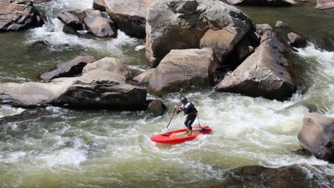 Whitewater stand-up paddleboarder Matt Moses navigates the On the Rocks rapid on a stretch of the Nolichucky River in North Carolina.