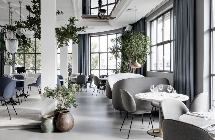 This pan-Indian restaurant is located within Copenhagen's The Standard hotel. Verandah's design is the work of design duo Stine Gam and Enrico Fratesi. The soft minimalism, punctuated with green planted accents sits in an attractive the original 1930′s building. <br /><br />Design by GamFratesi, Photo by Enok Holsegård and Dinesen/Hviid Photography from <a href="index.php?page=&url=http%3A%2F%2Fshop.gestalten.com%2Fout-again.html" target="_blank" target="_blank">Let's Go Out Again</a>, Copyright Gestalten 2015