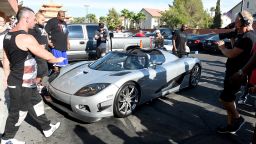 Floyd Mayweather pulls up at the Mayweather Boxing Club in his new $4.8 million car.