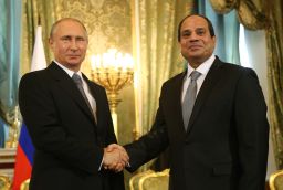 Russian President Vladimir Putin greets Egyptian President Abdel Fattah el-Sisi at the Kremlin on August 26.