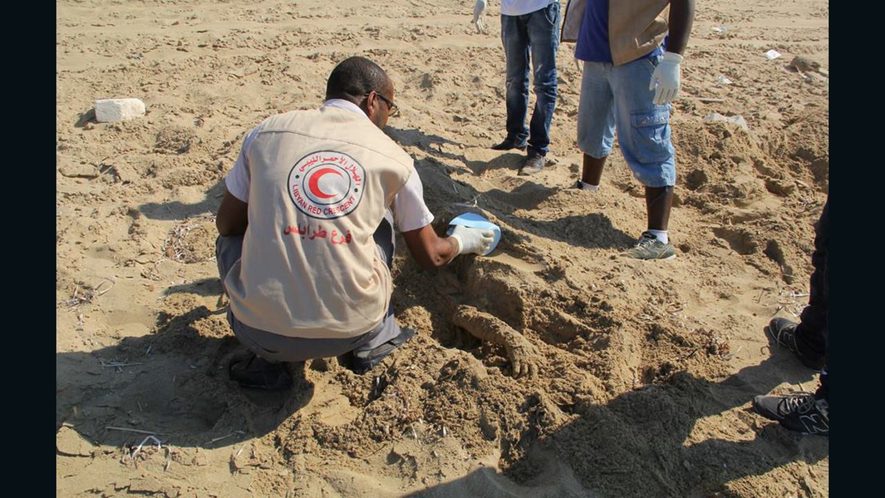 Libyan Red Crescent volunteers recover the body of a migrant who drowned while trying to reach Europe.