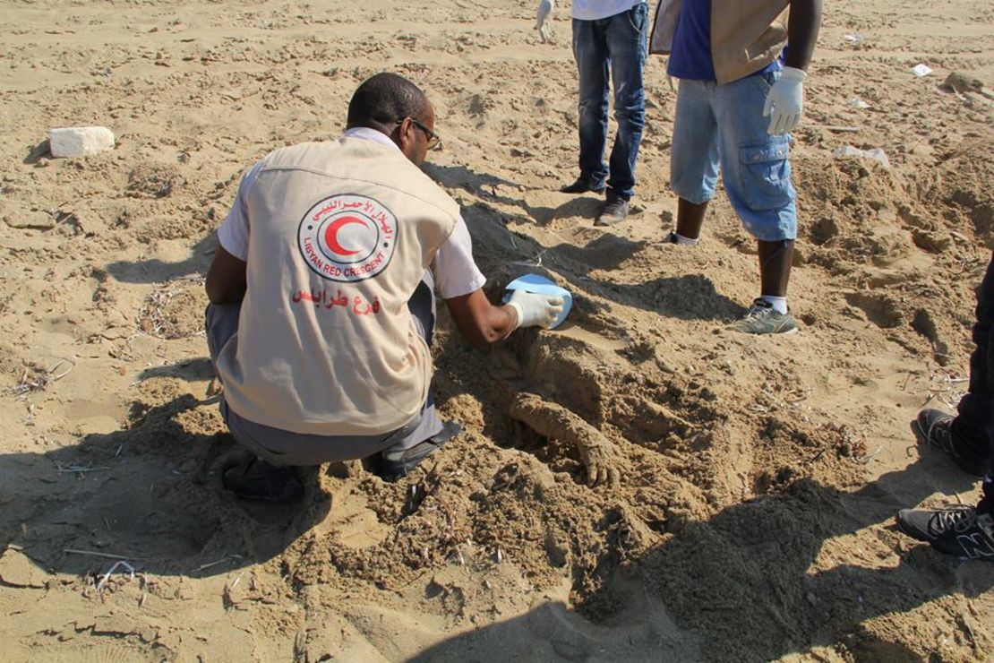 Libyan Red Crescent volunteers recover the body of a migrant who drowned while trying to reach Europe.