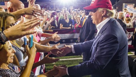 Republican presidential candidate Donald Trump greets supporters after his rally at Ladd-Peebles Stadium on August 21, 2015 in Mobile, Alabama.