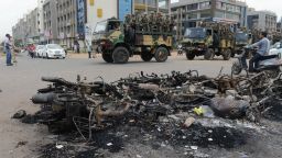 Indian army troops patrol next to the burnt-out remains of vehicles after violent protests in Ahmedabad on August 27, 2015. A court in Gujarat ordered a police inquiry August 27 after at least ten people died in the worst violence to hit the Indian prime minister's home state in more than a decade. AFP PHOTO / Sam PANTHAKYSAM PANTHAKY/AFP/Getty Images