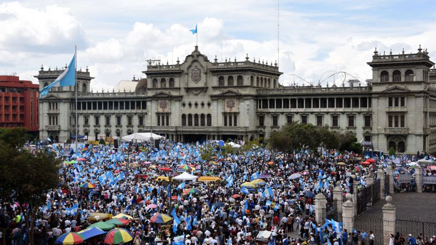 People demonstrate in demand of Guatemalan President Otto Perez to step down over a corruption scandal, in front of the National Palace Guatemala City on August 27, 2015. Perez suffered a double setback Wednesday, after the country's top prosecutor called for his resignation and his ex-vice president was maintained in jail for tax fraud. AFP PHOTO / JOHAN ORDONEZJOHAN ORDONEZ/AFP/Getty Images