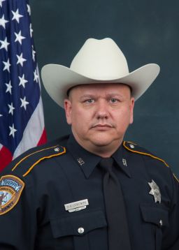 A man gunned down Darren H. Goforth, 47, as he returned to his patrol car after pumping gas 