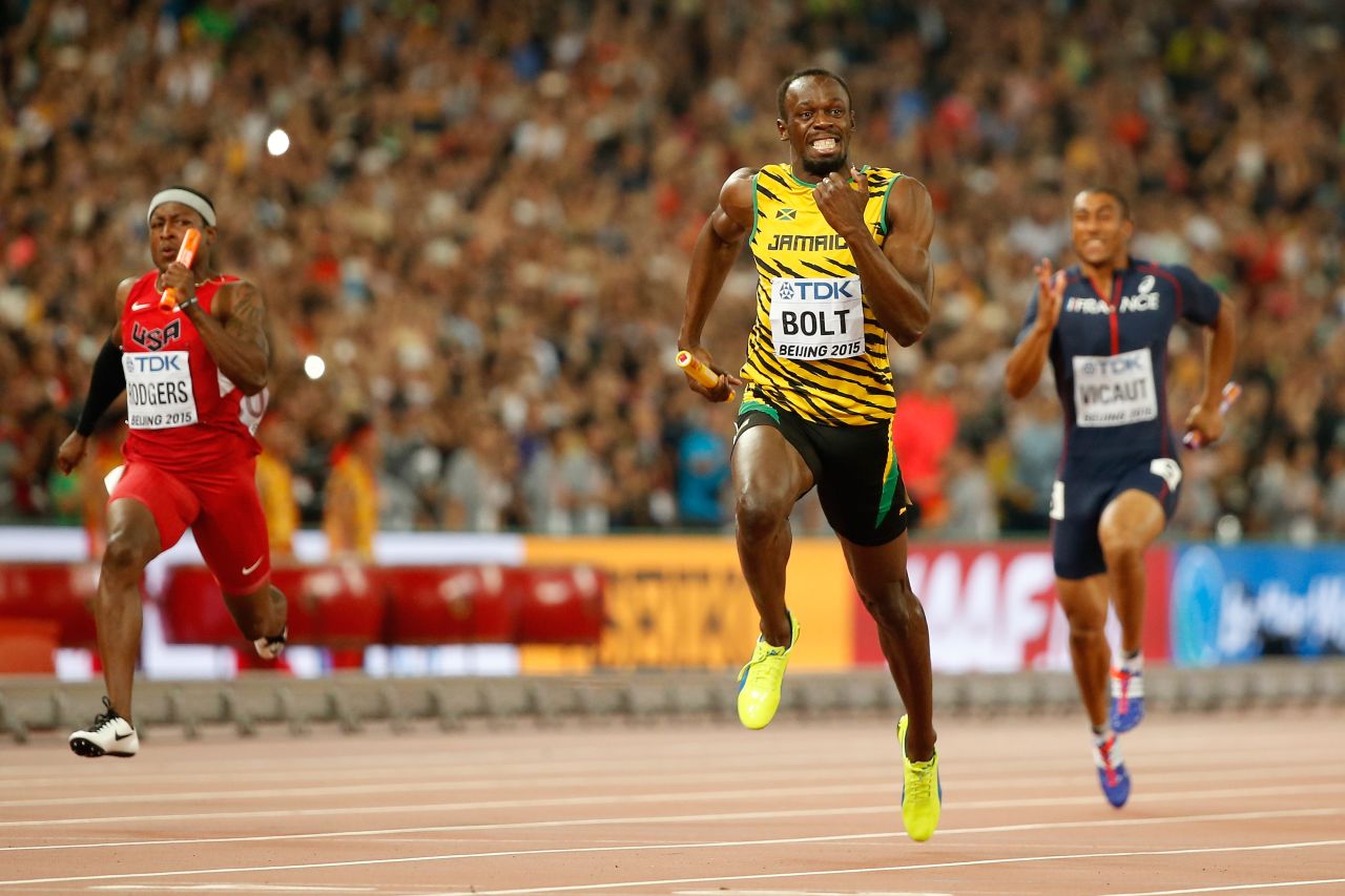 Usain Bolt of Jamaica crosses the finish line to win gold in the men's 4x100 metres relay final ahead of Mike Rodgers of the United States at the 2015 World Athletics Championships in Beijing.