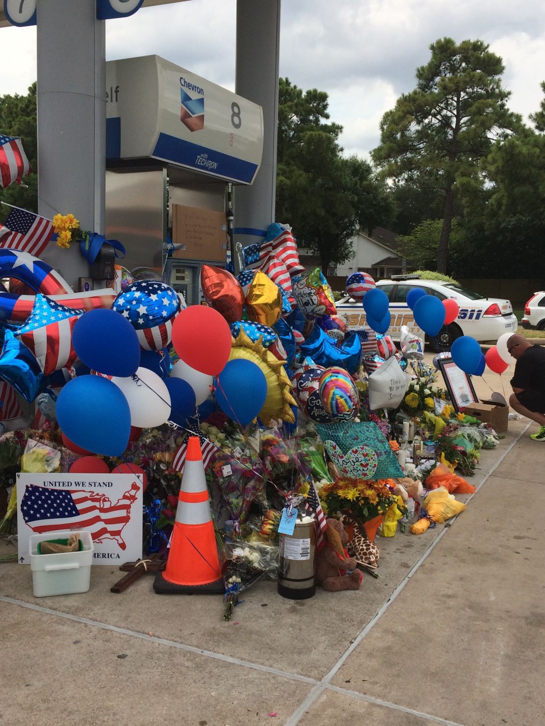 Mourners created a memorial at the gas station where Goforth was killed.