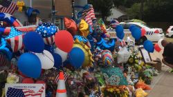 Mourners created a makeshift memorial at the Houston gas station where Harris County Sheriff's Deputy Darren Goforth was gunned down. 
