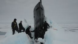 150730-N-ZZ999-008 ARCTIC OCEAN (July 30, 2015) Sailors aboard the fast attack submarine USS Seawolf (SSN 21) remove Arctic ice from the hull after surfacing at the North Pole. Seawolf conducted routine Arctic operations. (U.S. Navy photo/Released)