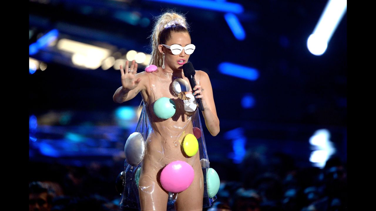 We aren't even sure what to call this dot-covered plastic outfit, but kudos to Miley on the glasses. 