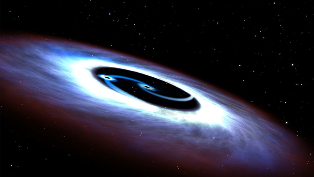 An artist's illustration shows a binary black hole found in the quasar at the center of the Markarian 231 galaxy. Astronomers using NASA's Hubble Space Telescope  <a href="http://www.cnn.com/2015/08/31/us/double-black-hole-nasa-hubble-feat/" target="_blank">discovered the galaxy being powered by two black holes</a> "furiously whirling about each other," the space agency said in a news release.